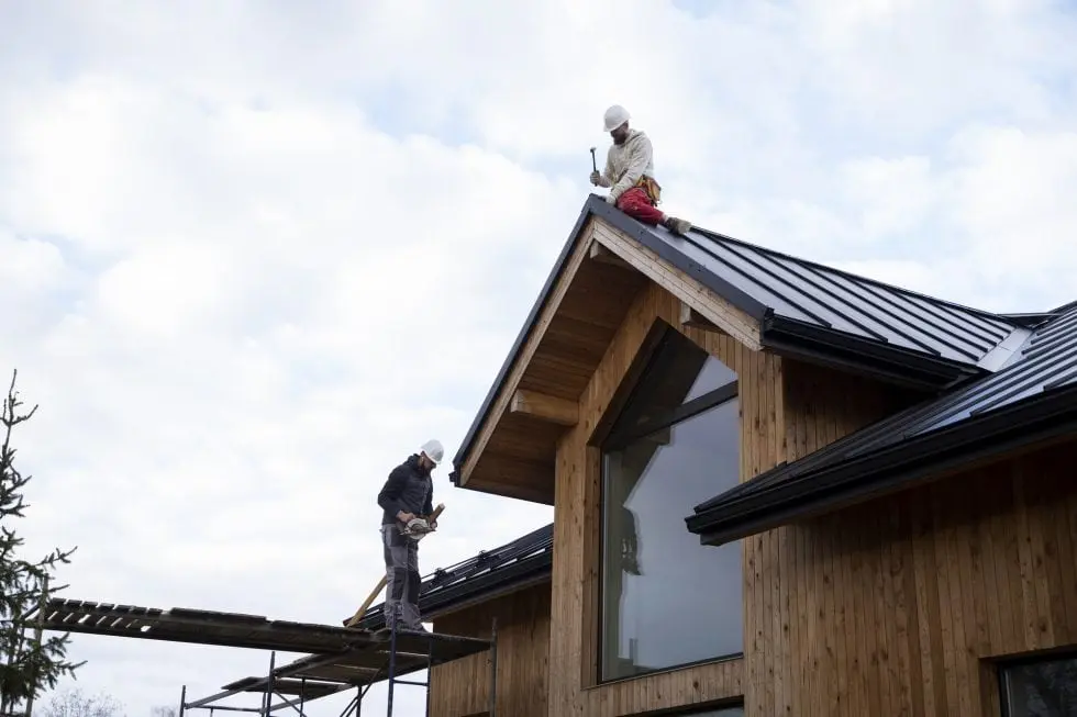 long shot men working roof 980x653 1